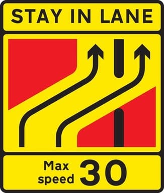 Road sign for one lane crossover at contraflow road works